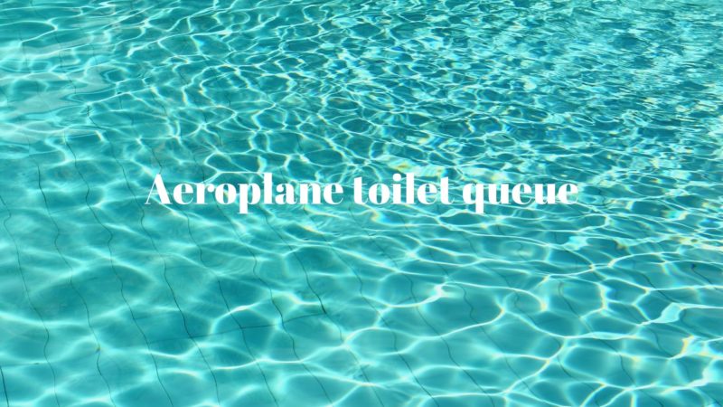 A shimmering turquoise pool reflects sunlight, with gentle ripples creating a serene atmosphere. The text "Aeroplane toilet queue" is prominently displayed in white.