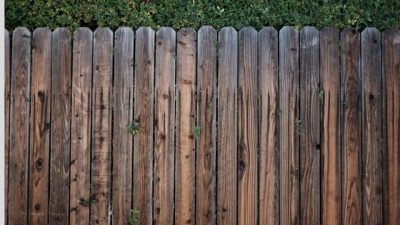 Lifting portable toilets over walls and fences